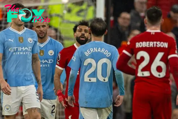 LIVERPOOL, ENGLAND - Sunday, March 10, 2024: Liverpool's Mohamed Salah (L) clashes with Manchester City's Bernardo Silva during the FA Premier League match between Liverpool FC and Manchester City FC at Anfield. (Photo by David Rawcliffe/Propaganda)