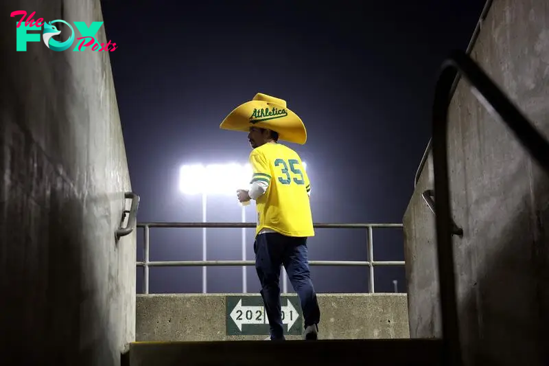 OAKLAND, CALIFORNIA - SEPTEMBER 24: A fan walks up to the stands during the Oakland Athletics game Texas Rangers at the Oakland Coliseum on September 24, 2024 in Oakland, California.   Ezra Shaw/Getty Images/AFP (Photo by EZRA SHAW / GETTY IMAGES NORTH AMERICA / Getty Images via AFP)