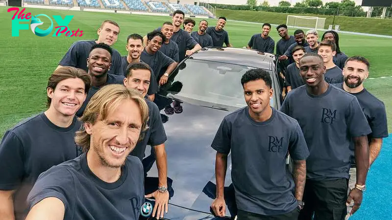 The Real Madrid players pose in front of someone's new car, which now most likely has a key scratch on the door.