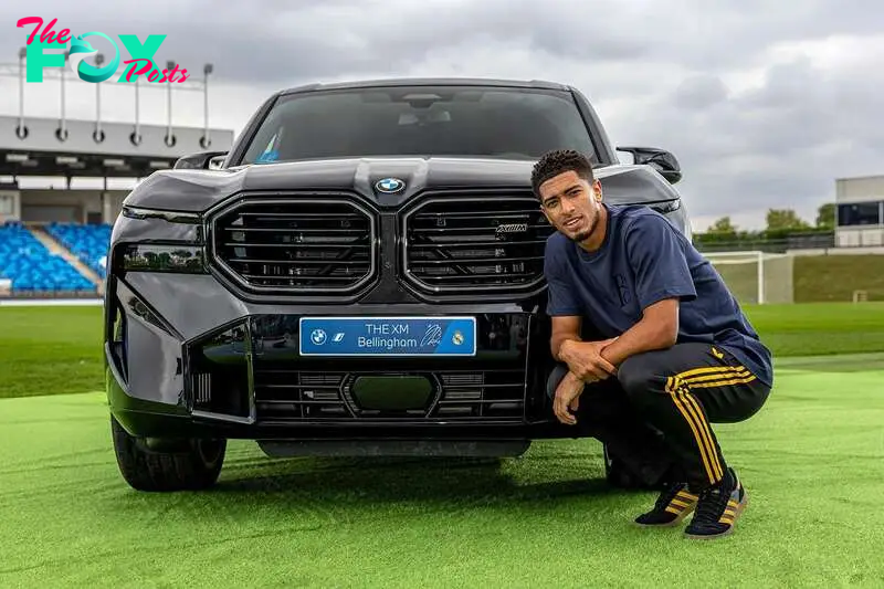 Jude poses with his new BMW.