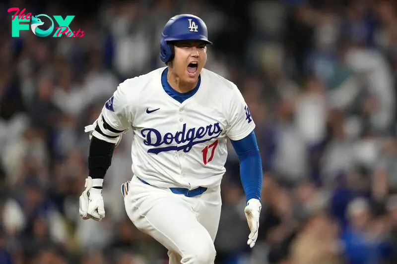 Sep 25, 2024; Los Angeles, California, USA; Los Angeles Dodgers designated hitter Shohei Ohtani (17) celebrates after hitting a single in the sixth inning against the San Diego Padres at Dodger Stadium. Mandatory Credit: Kirby Lee-Imagn Images