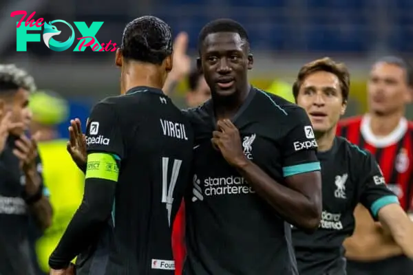 MILAN, ITALY - Tuesday, September 17, 2024: Liverpool's goal-scorers Ibrahima Konaté (R) and captain Virgil van Dijk celebrate after the UEFA Champions League game between AC Milan and Liverpool FC at the Stadio San Siro. Liverpool won 3-1. (Photo by David Rawcliffe/Propaganda)