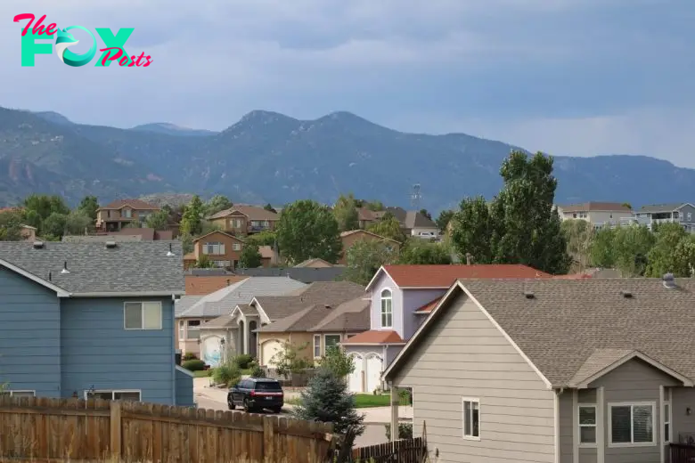 Suburban rooftops with the foothills west of Colorado Springs as a backdrop.