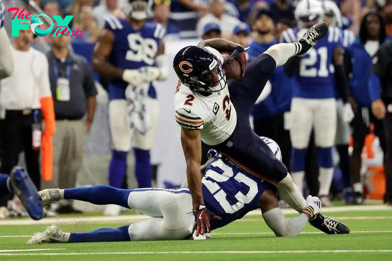 Kenny Moore II, #23 of the Indianapolis Colts, tackles DJ Moore #2 of the Chicago Bears during the second half at Lucas Oil Stadium on September 22, 2024, in Indianapolis, Indiana.  