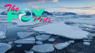 Gentle sunrise in Jokulsaron Lagoon where icebergs float and move slowly, dragged by the current.