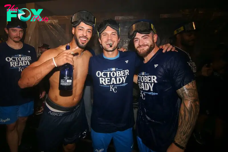 Sep 27, 2024; Atlanta, Georgia, USA; Kansas City Royals left fielder MJ Melendez (1) and second baseman Adam Frazier (26) and center fielder Kyle Isbel (28) celebrate after clinching a wild card playoff birth after a game against the Atlanta Braves at Truist Park. Mandatory Credit: Brett Davis-Imagn Images