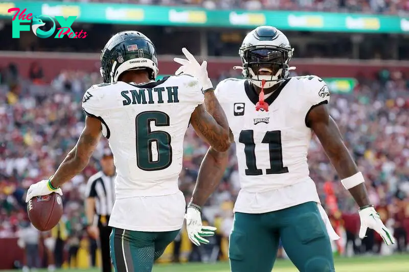 LANDOVER, MARYLAND - OCTOBER 29: DeVonta Smith #6 of the Philadelphia Eagles celebrates a touchdown with A.J. Brown #11 during the fourth quarter against the Washington Commanders at FedExField on October 29, 2023 in Landover, Maryland.   Patrick Smith/Getty Images/AFP (Photo by Patrick Smith / GETTY IMAGES NORTH AMERICA / Getty Images via AFP)