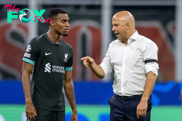 MILAN, ITALY - Tuesday, September 17, 2024: Liverpool's head coach Arne Slot (R) speaks with Ryan Gravenberch before the start of the second half during the UEFA Champions League game between AC Milan and Liverpool FC at the Stadio San Siro. Liverpool won 3-1. (Photo by David Rawcliffe/Propaganda)