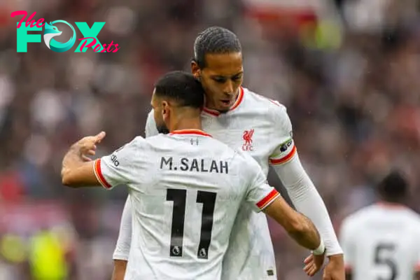 MANCHESTER, ENGLAND - Sunday, September 1, 2024: Liverpool's Mohamed Salah (L) celebrates with team-mate captain Virgil van Dijk after scoring the third goal during the FA Premier League match between Manchester United FC and Liverpool FC at Old Trafford. Liverpool won 3-0. (Photo by David Rawcliffe/Propaganda)