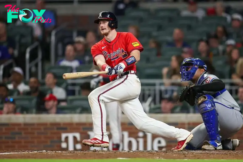 Sep 27, 2024; Atlanta, Georgia, USA; Atlanta Braves catcher Sean Murphy (12) hits a two-run home run against the Kansas City Royals in the fourth inning at Truist Park. Mandatory Credit: Brett Davis-Imagn Images