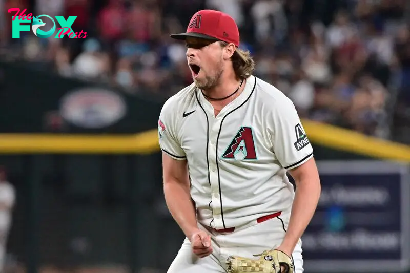 Sep 25, 2024; Phoenix, Arizona, USA; Arizona Diamondbacks pitcher Kevin Ginkel (37) celebrates after beating the San Francisco Giants at Chase Field. Mandatory Credit: Matt Kartozian-Imagn Images