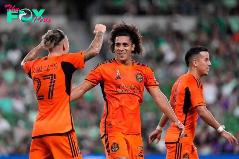 Sep 21, 2024; Austin, Texas, USA; Houston Dynamo FC midfielder Coco Carrasquilla (20) celebrates with midfielder Sebastian Kowalczyk (27) after scoring a goal against Austin FC in the second half at Q2 Stadium. Mandatory Credit: Scott Wachter-Imagn Images