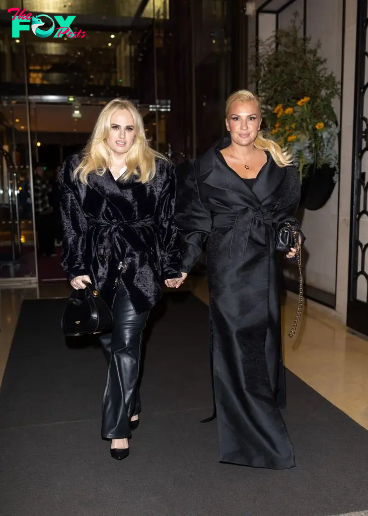 Rebel Wilson and Ramona Agruma walking in all black outfits