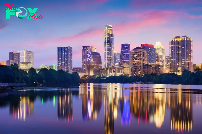 Photo of Austin, Texas at night overlooking the city, river and park.