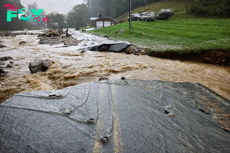 Bridge over creek destroyed by flood waters from Tropical Storm Helene in Vilas, North Carolina