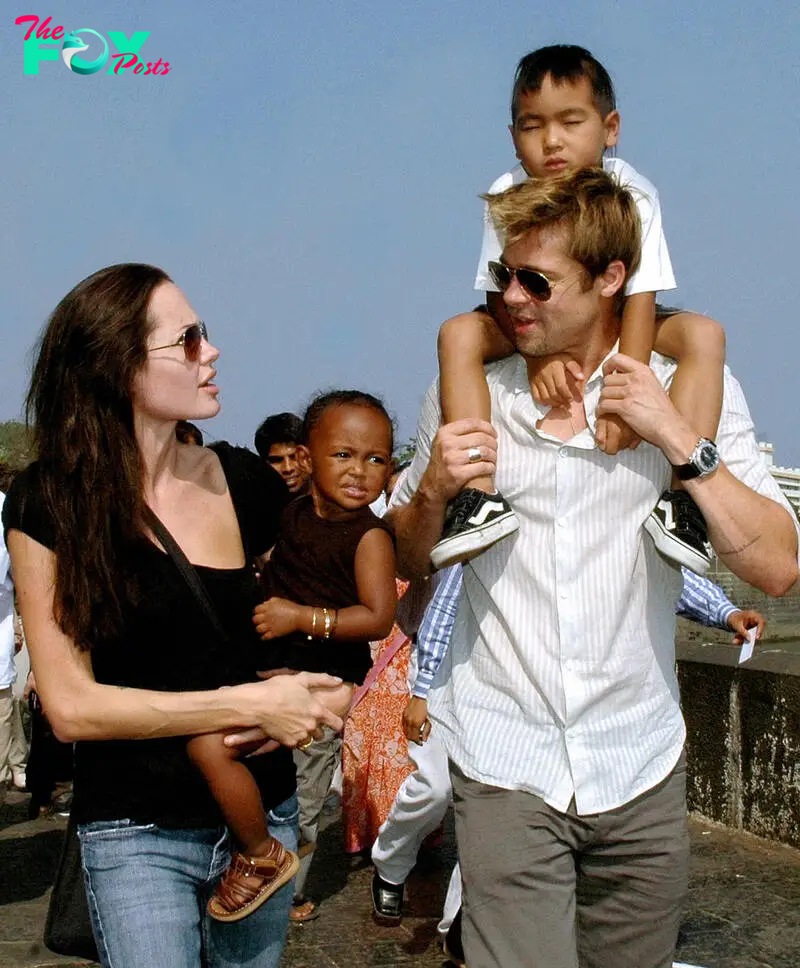 Angelina Jolie, Zahara Jolie Pitt, Brad Pitt, and Maddox Pitt walking at the seafront promenade in Mumbai on November 12, 2006. | Source: Getty Images