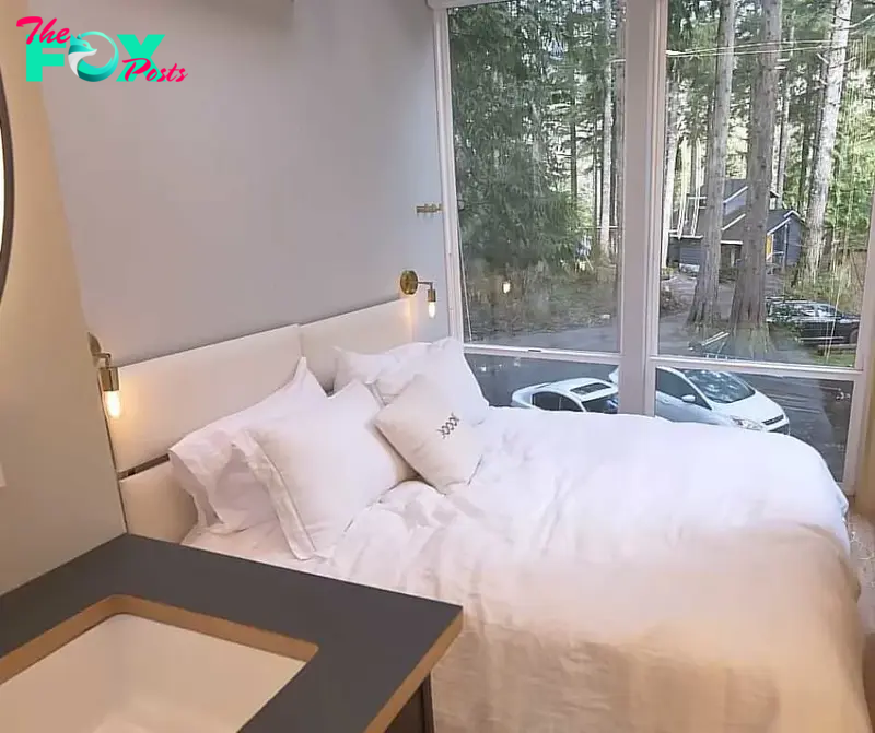 Eco-friendly home's guest room with glass walls that offers amazing view of the surrounding.