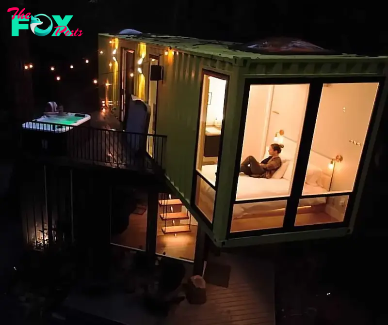 Nick's luxury eco-friendly home at night with a man in tub and a woman on bed in the guestroom.