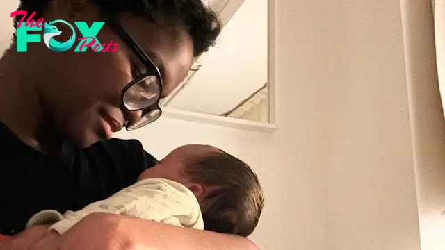 Oti Mabuse looking at her newborn daughter