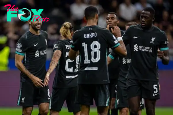 MILAN, ITALY - Tuesday, September 17, 2024: Liverpool's Dominik Szoboszlai (L) celebrates with team-mates after scoring his side's third goal during the UEFA Champions League game between AC Milan and Liverpool FC at the Stadio San Siro. Liverpool won 3-1. (Photo by David Rawcliffe/Propaganda)