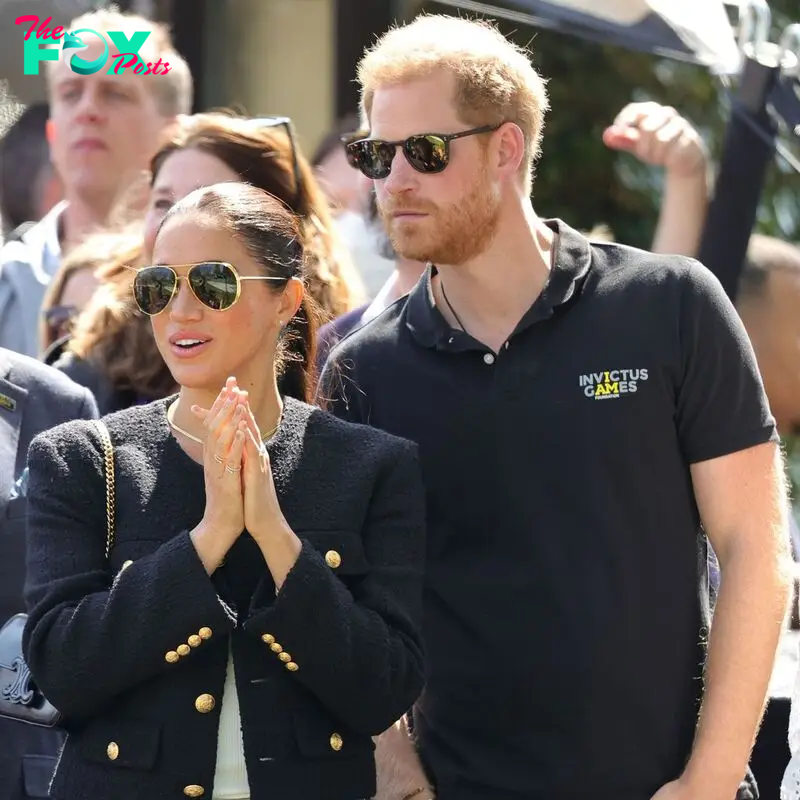 Meghan Markle and Prince Harry in black outfits during the Invictus Games