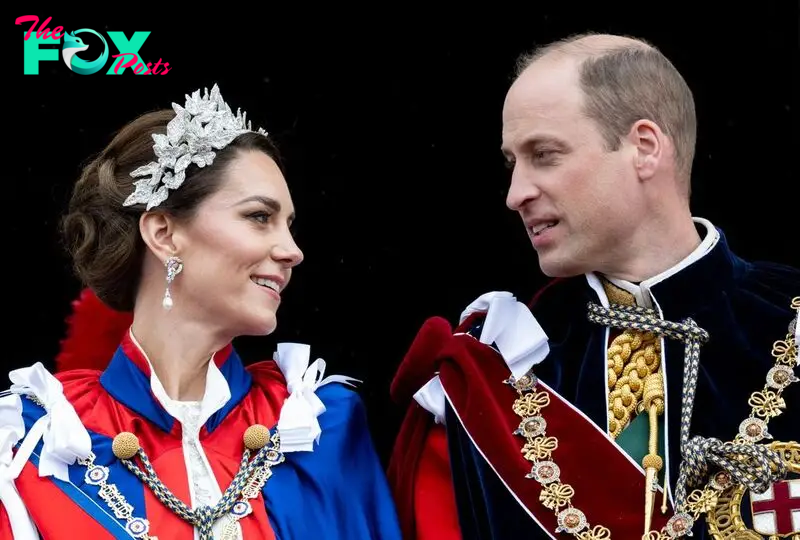 William and Kate looking at each other on palace balcony at the coronation