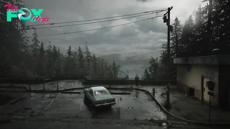 A wide shot of a car in a parking lot. A man stands outside of it, looking out at some evergreens and cloudy skies