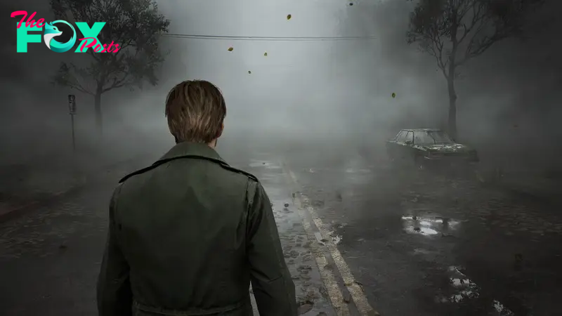 James, the protagonist of Silent Hill 2, faces away from the viewer towards a very foggy street