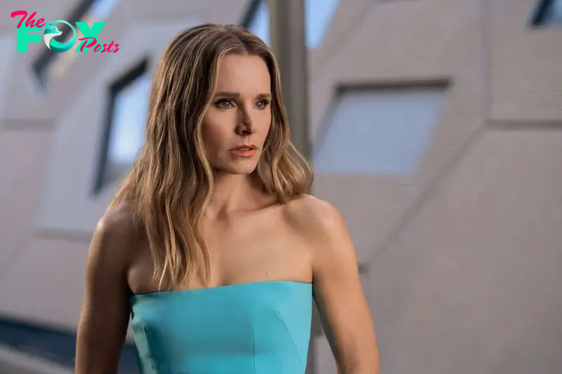 Kristen Bell as Joanne in episode 110 of Nobody Wants This. She's wearing a blue strapless dress. 