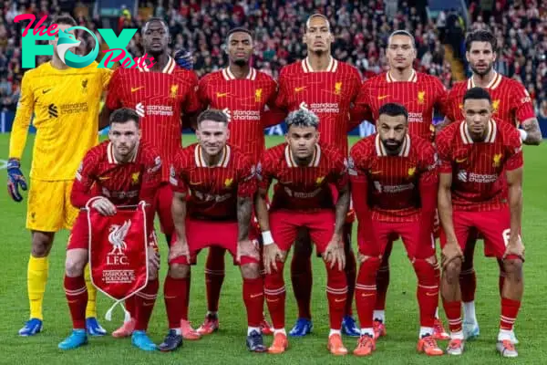 LIVERPOOL, ENGLAND - Wednesday, October 2, 2024: Liverpool players line-up for a team group photograph before the UEFA Champions League game between Liverpool FC and Bologna FC 1909 at Anfield. Back row L-R: goalkeeper Alisson Becker, Ibrahima Konaté, Ryan Gravenberch, captain Virgil van Dijk, Darwin Núñez, Dominik Szoboszlai. Front row L-R: Bologna’s Charalampos Lykogiannis, Alexis Mac Allister, Luis Díaz, Mohamed Salah, Trent Alexander-Arnold. (Photo by David Rawcliffe/Propaganda)