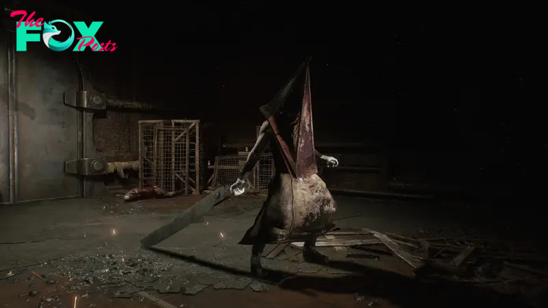 Pyramid Head stands in the darkness, holding a massive blade