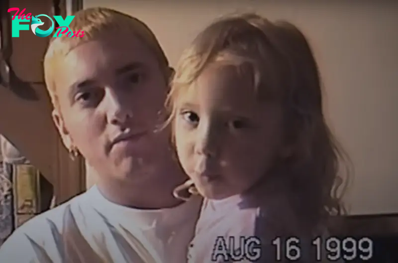 Eminem holds Hailie Jade in 1999