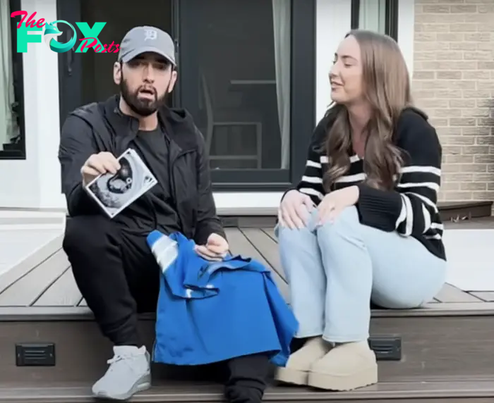 Eminem with Hailie Jade sitting on steps outside