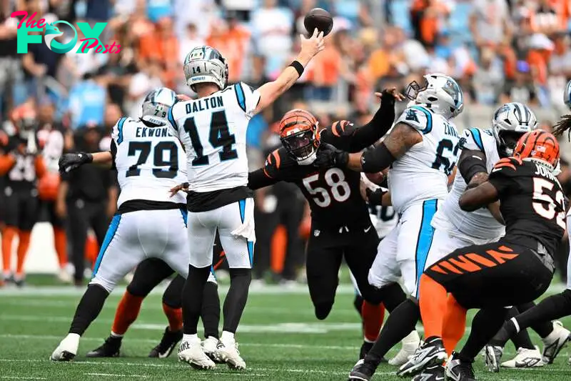 CHARLOTTE, NORTH CAROLINA - SEPTEMBER 29: Andy Dalton #14 of the Carolina Panthers throws a pass in the fourth quarter against the Cincinnati Bengals at Bank of America Stadium on September 29, 2024 in Charlotte, North Carolina.   Matt Kelley/Getty Images/AFP (Photo by Matt Kelley / GETTY IMAGES NORTH AMERICA / Getty Images via AFP)