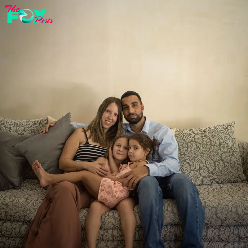 Doron and Yoni Asher with their daughters Raz and Aviv at home in Herzliya, Israel, on Oct. 5, 2024.