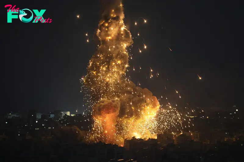 Explosions erupt as Israeli forces shell buildings in Beirut, on Oct. 6, 2024.