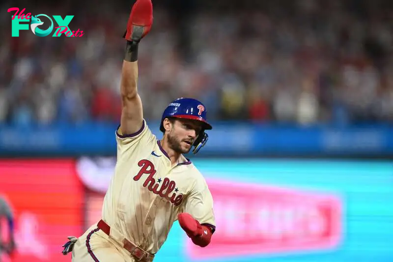 Oct 6, 2024; Philadelphia, Pennsylvania, USA; Philadelphia Phillies shortstop Trea Turner (7) celebrates after scoring the game wining run in the ninth inning against the New York Mets during game two of the NLDS for the 2024 MLB Playoffs at Citizens Bank Park. Mandatory Credit: Kyle Ross-Imagn Images