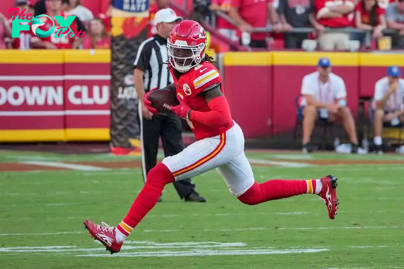 Sep 15, 2024; Kansas City, Missouri, USA; Kansas City Chiefs wide receiver Rashee Rice (4) catches a pass against the Cincinnati Bengals during the game at GEHA Field at Arrowhead Stadium. Mandatory Credit: Denny Medley-Imagn Images