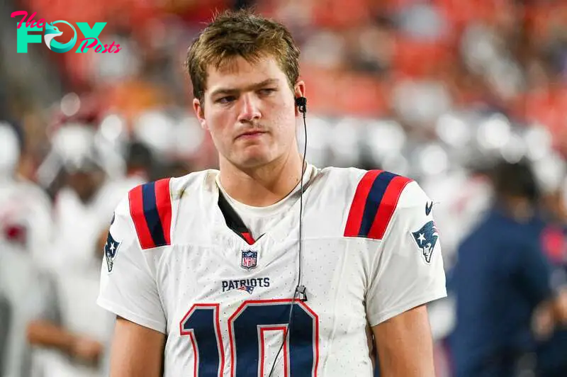 Aug 25, 2024; Landover, Maryland, USA;  New England Patriots quarterback Drake Maye (10) stands in the bench area during the second  half against the Washington Commanders at Commanders Field. Mandatory Credit: Tommy Gilligan-USA TODAY Sports