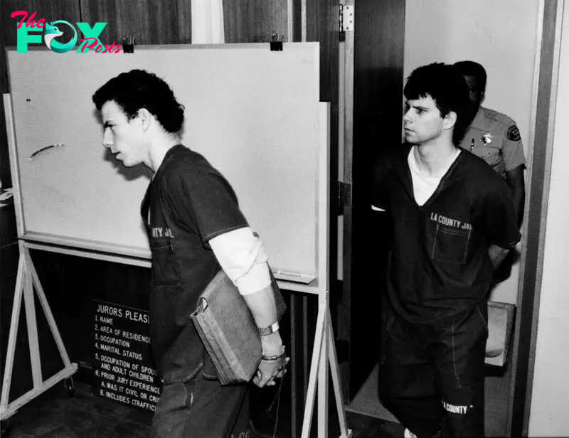 Erik Menendez, left, and his brother Lyle, wearing jail outfits, are led into courtroom. June 15, 1990