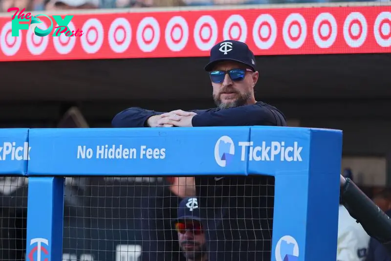 MINNEAPOLIS, MN - SEPTEMBER 29: Rocco Baldelli #5 of the Minnesota Twins looks on from the dugout in the ninth inning against the Baltimore Orioles at Target Field on September 29, 2024 in Minneapolis, Minnesota. The Baltimore Orioles defeated the Minnesota Twins 6-2.  Adam Bettcher/Getty Images/AFP (Photo by Adam Bettcher / GETTY IMAGES NORTH AMERICA / Getty Images via AFP)