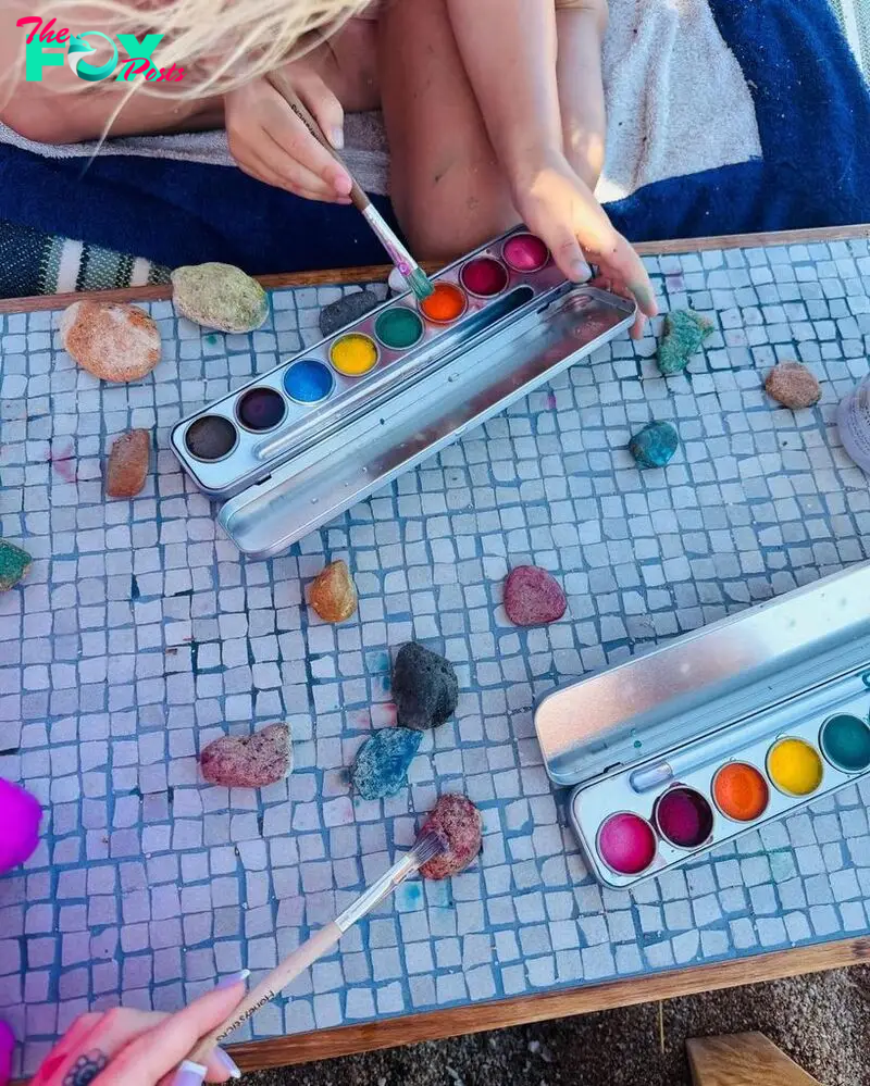 Katy Perry and her daughter Daisy Dove Bloom paint together during a family trip to Sardinia, captured on Instagram