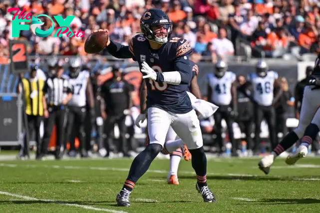 Oct 6, 2024; Chicago, Illinois, USA; Chicago Bears quarterback Caleb Williams (18) passes the ball against the Carolina Panthers during the third quarter at Soldier Field. Mandatory Credit: Daniel Bartel-Imagn Images