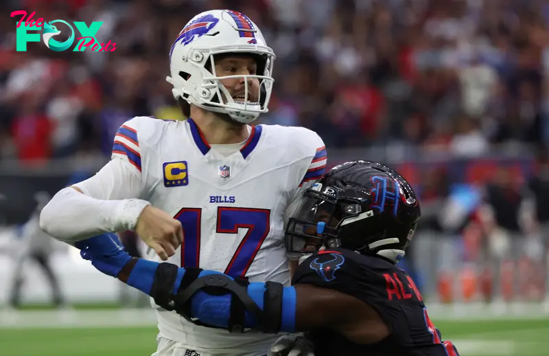 Oct 6, 2024; Houston, Texas, USA; Buffalo Bills quarterback Josh Allen (17) is hit by Houston Texans linebacker Azeez Al-Shaair (0) in the second half at NRG Stadium. Mandatory Credit: Thomas Shea-Imagn Images