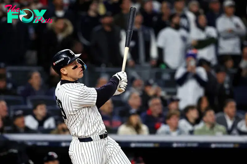 Oct 15, 2024; Bronx, New York, USA; New York Yankees outfielder Aaron Judge (99) hits a two run home run during the seventh inning against the Cleveland Guardians in game two of the ALCS for the 2024 MLB Playoffs at Yankee Stadium. Mandatory Credit: Wendell Cruz-Imagn Images