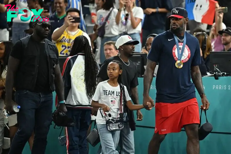 LeBron James arrives with his daughter Zhuri to watch the women's Gold Medal basketball match between France and the USA during the Paris 2024 Olympic Games at the Bercy  Arena in Paris on August 11, 2024