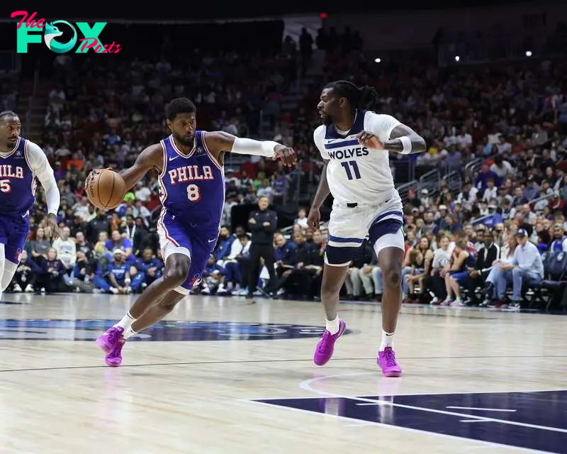 Oct 11, 2024; Des Moines, Iowa, USA;  Minnesota Timberwolves center Naz Reid (11) defends Philadelphia 76ers forward Paul George (8) at Wells Fargo Arena. Mandatory Credit: Reese Strickland-Imagn Images