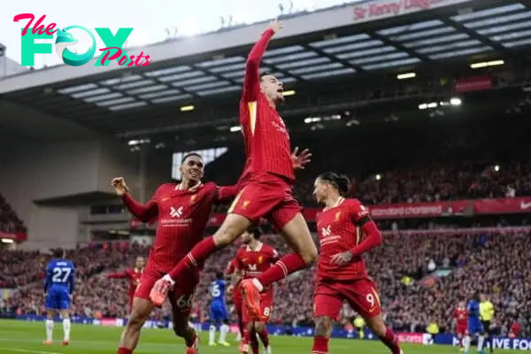 Curtis Jones (centre) celebrates scoring Liverpool’s winner (Peter Byrne/PA)