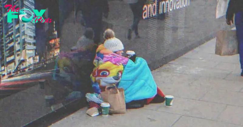 Homeless woman sitting on the street | Source: Shutterstock