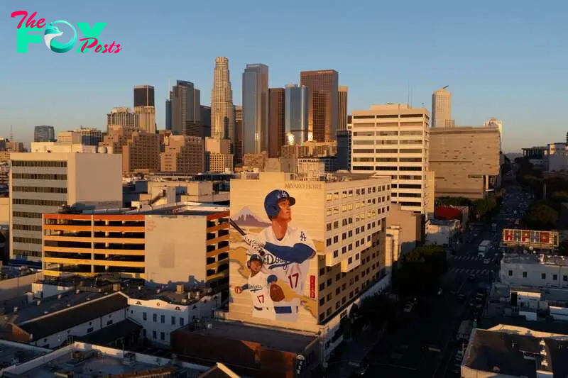 The drone view of a giant mural of Los Angeles Dodgers Shohei Ohtani, painted by artist Robert Vargas, is shown on the side of a hotel in Little Tokyo, a neighborhood in downtown Los Angeles, as the Japanese baseball player prepares for his first game against the New York Yankees at the World Series in Los Angeles, California, U.S. October 23, 2024.   REUTERS/Mike Blake